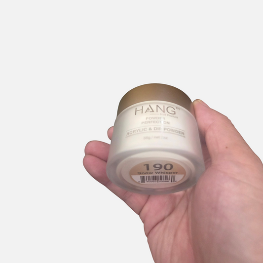 Beauty Zone Nail Supply Hang 4 in 1 Snow Whisper dip powder jar held in hand showing white shade and gold lid