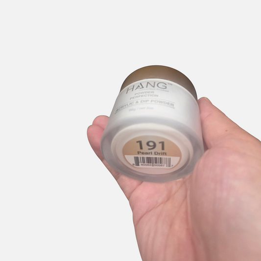Beauty Zone Nail Supply Hang 4 in 1 Pearl Drift dip powder jar held in a hand showing the shade label